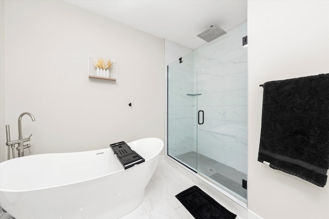 bathroom with shower with separate bathtub