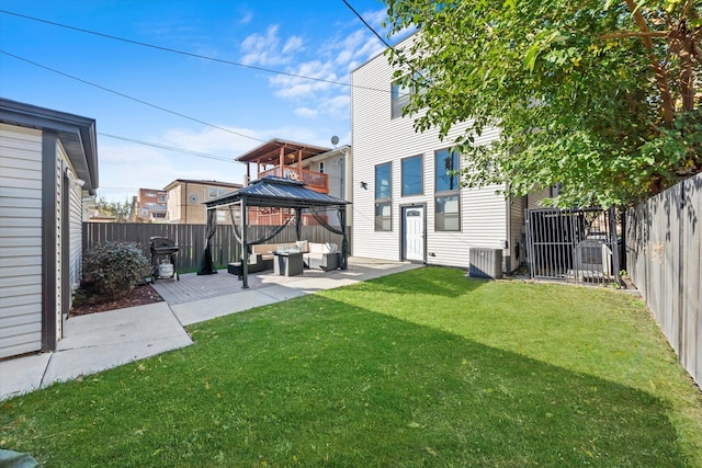 view of yard with central AC, a patio area, and a gazebo