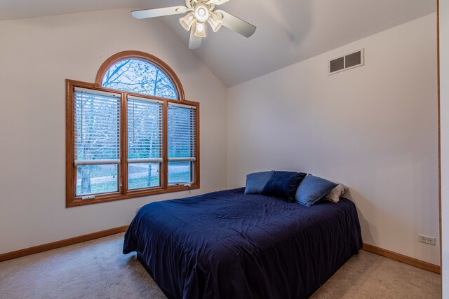 bedroom featuring light colored carpet, ceiling fan, and lofted ceiling