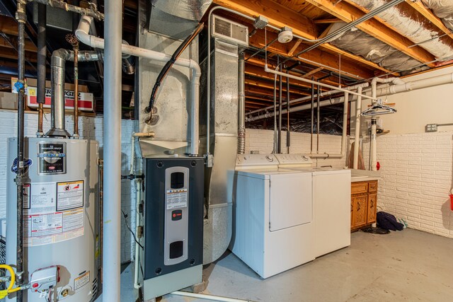 interior space featuring washing machine and dryer and water heater