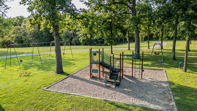 view of jungle gym featuring a lawn