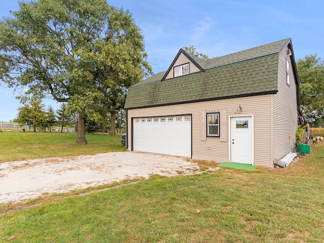 garage featuring a yard