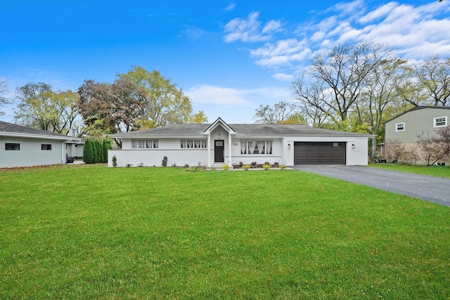 ranch-style home with a garage and a front yard