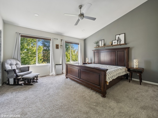 carpeted bedroom with ceiling fan and lofted ceiling