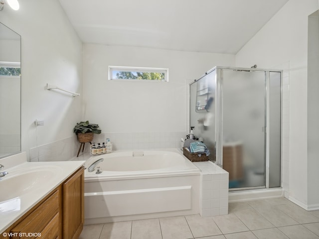 bathroom with tile patterned flooring, vanity, and independent shower and bath