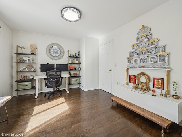 home office with dark hardwood / wood-style floors