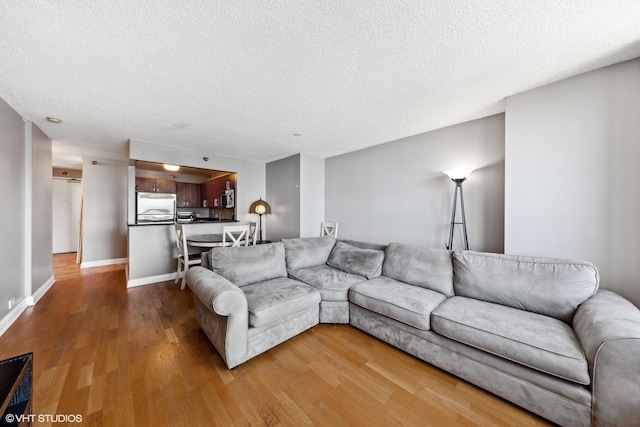 474 N Lake Shore Dr Unit 3303, Chicago, IL 60611 - living area with wood finished floors, a textured ceiling, and baseboards