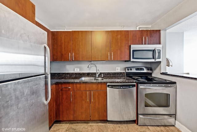 474 N Lake Shore Dr Unit 3303, Chicago, IL 60611 - kitchen featuring stainless steel appliances, a sink, dark stone countertops, and brown cabinets
