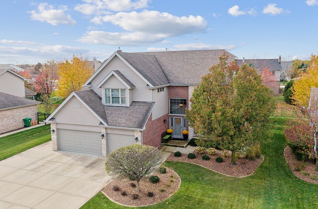 view of front of house featuring a garage and a front yard