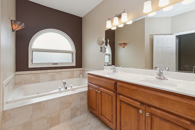 bathroom featuring vanity, tiled tub, and tile patterned floors