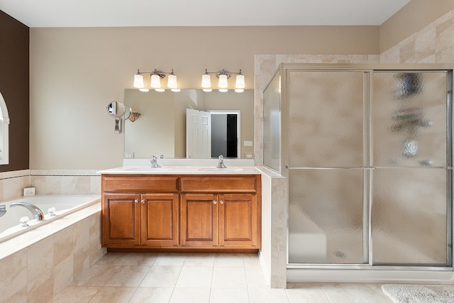 bathroom with vanity, shower with separate bathtub, and tile patterned flooring