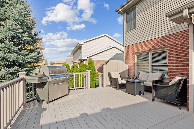 deck featuring an outdoor living space and grilling area