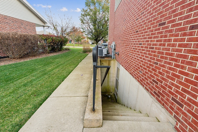 view of side of property with a yard