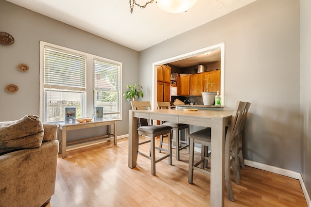 dining space with light hardwood / wood-style floors