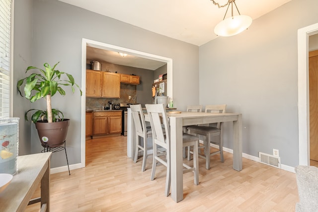 dining room with light wood-type flooring