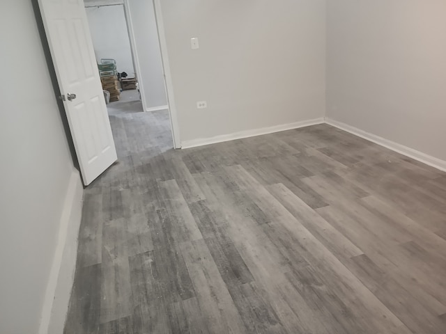 empty room with wood-type flooring