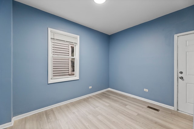 unfurnished room with light hardwood / wood-style flooring