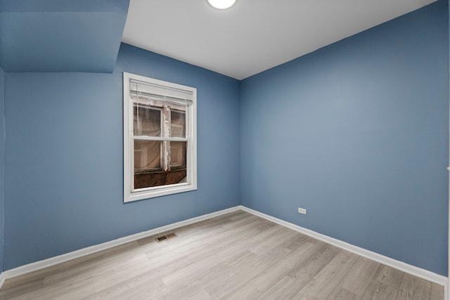 unfurnished room featuring light hardwood / wood-style floors