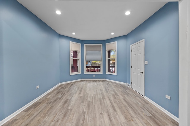 spare room featuring light hardwood / wood-style floors