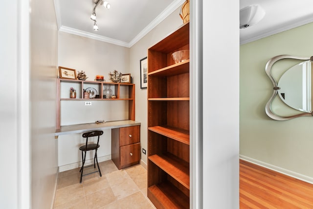 office area featuring ornamental molding and light hardwood / wood-style flooring