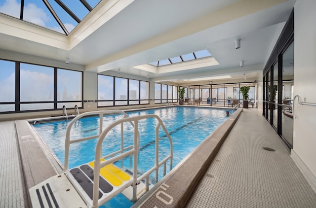 view of swimming pool with a skylight