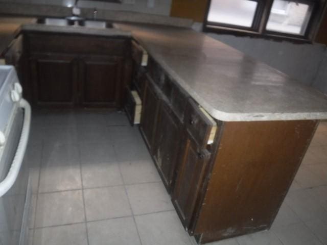 kitchen with sink and light tile patterned floors