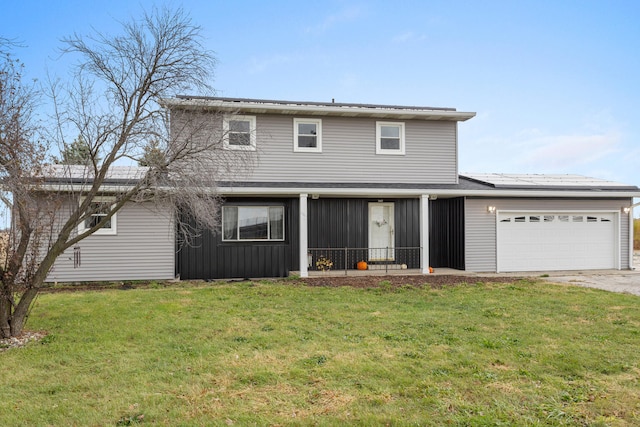 view of front of property with a front lawn, a garage, and solar panels