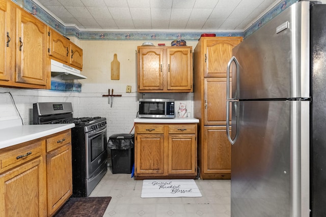 kitchen featuring ornamental molding and appliances with stainless steel finishes