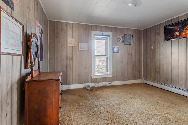 carpeted foyer entrance featuring wooden walls and a baseboard radiator