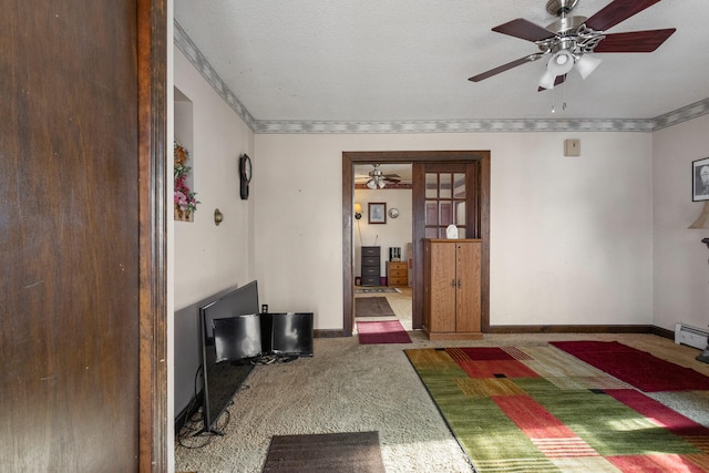 bedroom with crown molding, ceiling fan, a textured ceiling, and dark colored carpet