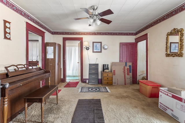 miscellaneous room with carpet floors and ceiling fan