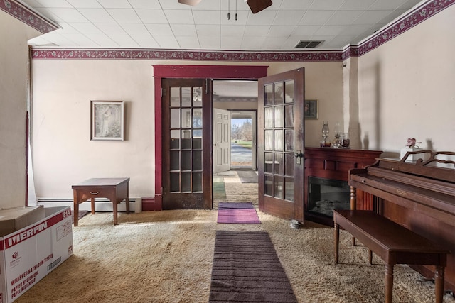 misc room featuring carpet flooring, ceiling fan, and french doors