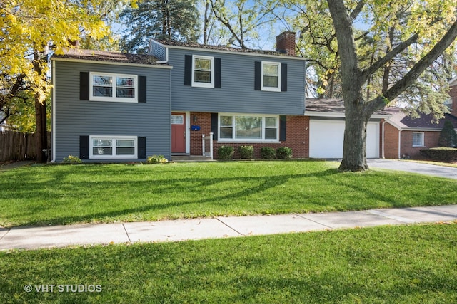 view of front of home featuring a garage and a front yard