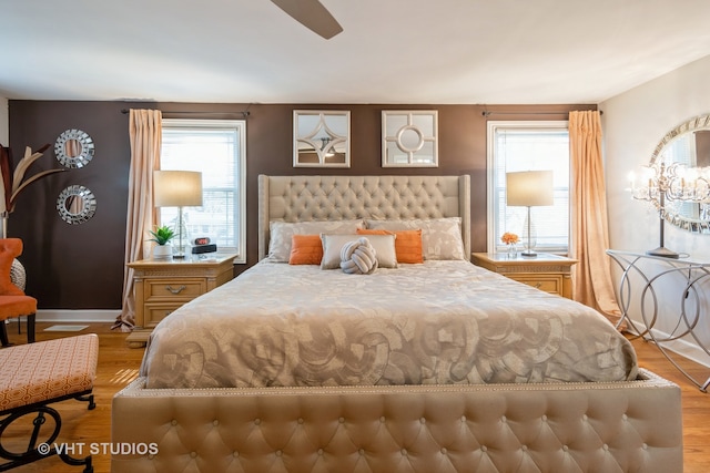 bedroom featuring light hardwood / wood-style flooring and ceiling fan