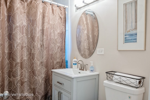 bathroom with vanity and toilet