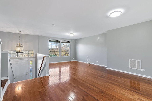 entrance foyer with a chandelier and hardwood / wood-style floors