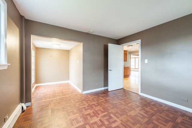 empty room with parquet flooring