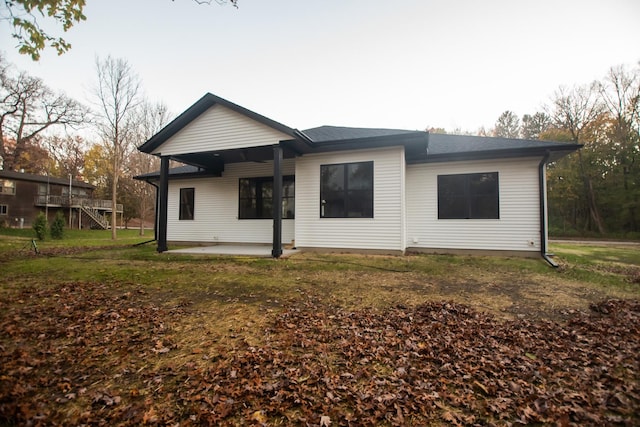 back of house with a patio