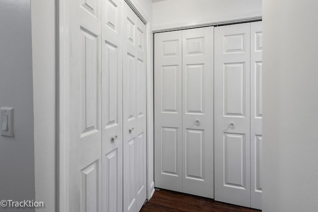 hall with dark hardwood / wood-style floors