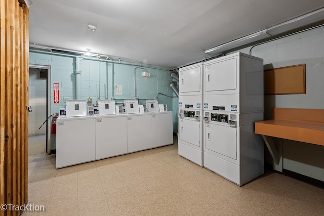 washroom featuring stacked washing maching and dryer and separate washer and dryer