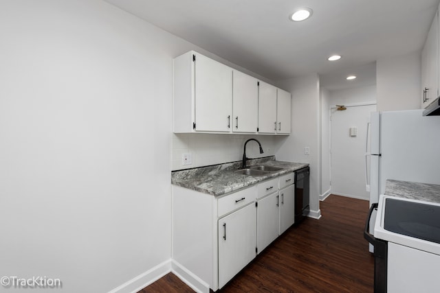 kitchen with white cabinets, stove, sink, and dark hardwood / wood-style floors