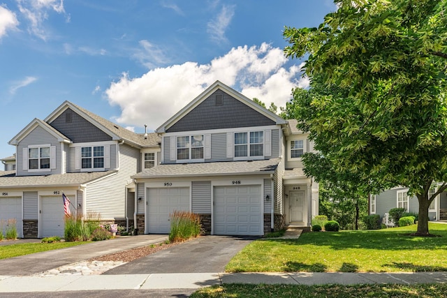 view of front of home with a garage and a front yard