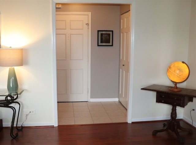 hallway featuring hardwood / wood-style flooring