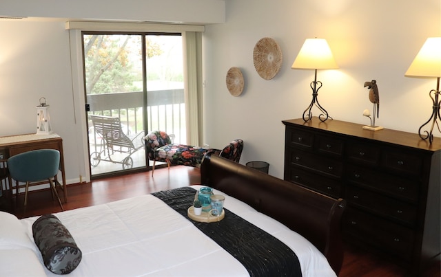 bedroom featuring dark hardwood / wood-style floors and access to exterior