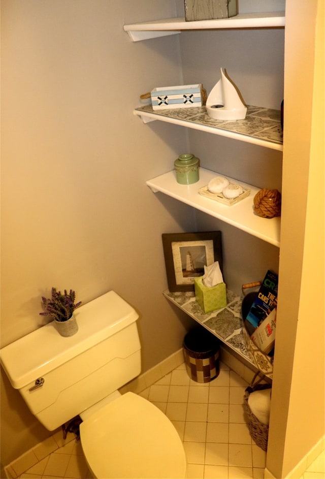 bathroom with tile patterned flooring and toilet