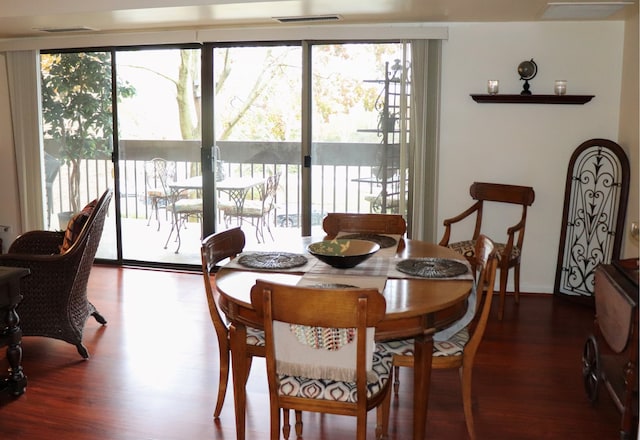 dining room with hardwood / wood-style floors