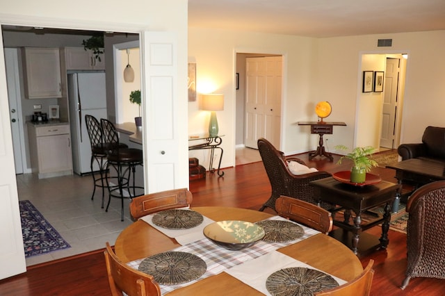 dining room with wood-type flooring