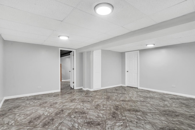 basement featuring a drop ceiling