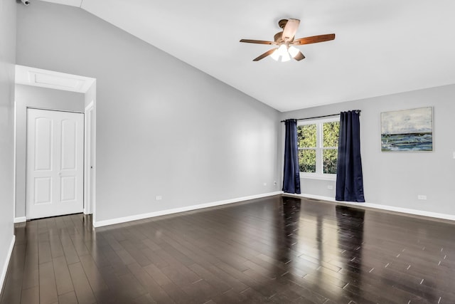 unfurnished room featuring dark wood-type flooring, ceiling fan, and lofted ceiling