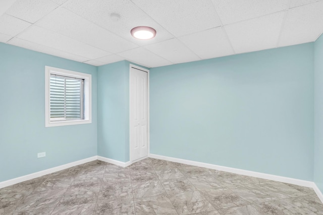 spare room with a drop ceiling